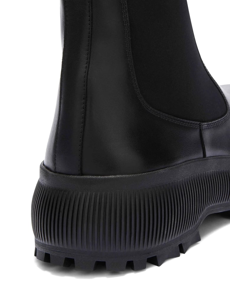 black leather chelsea boots by Selfnex