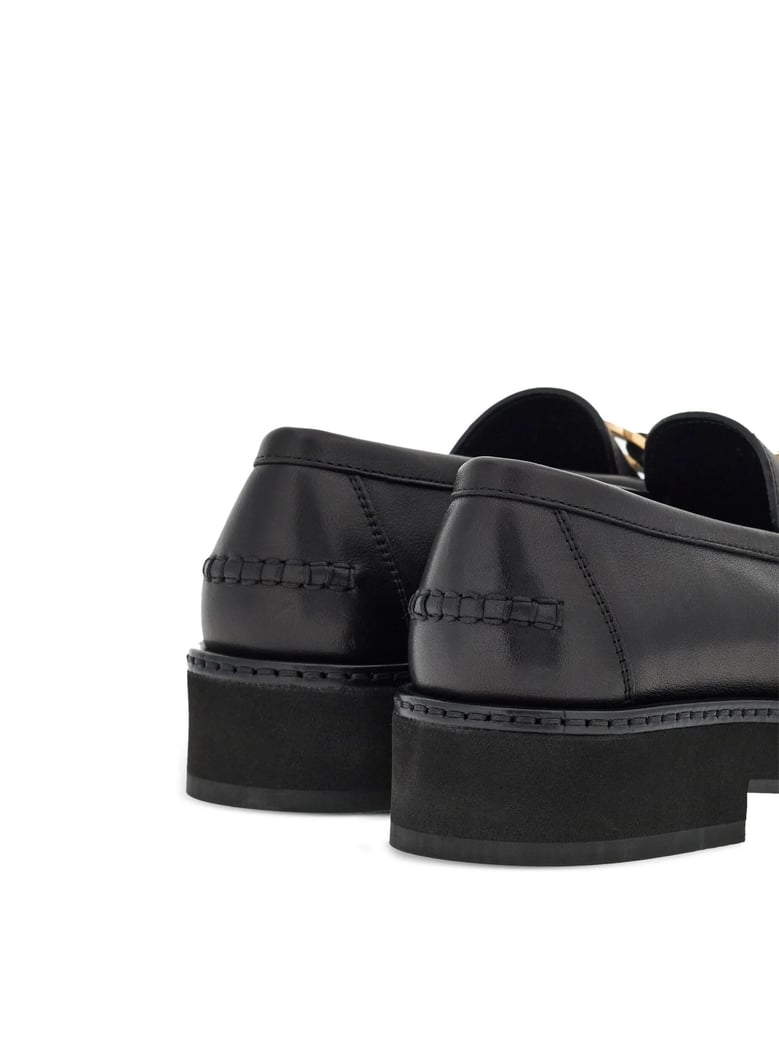black leather moccasins by Selfnex