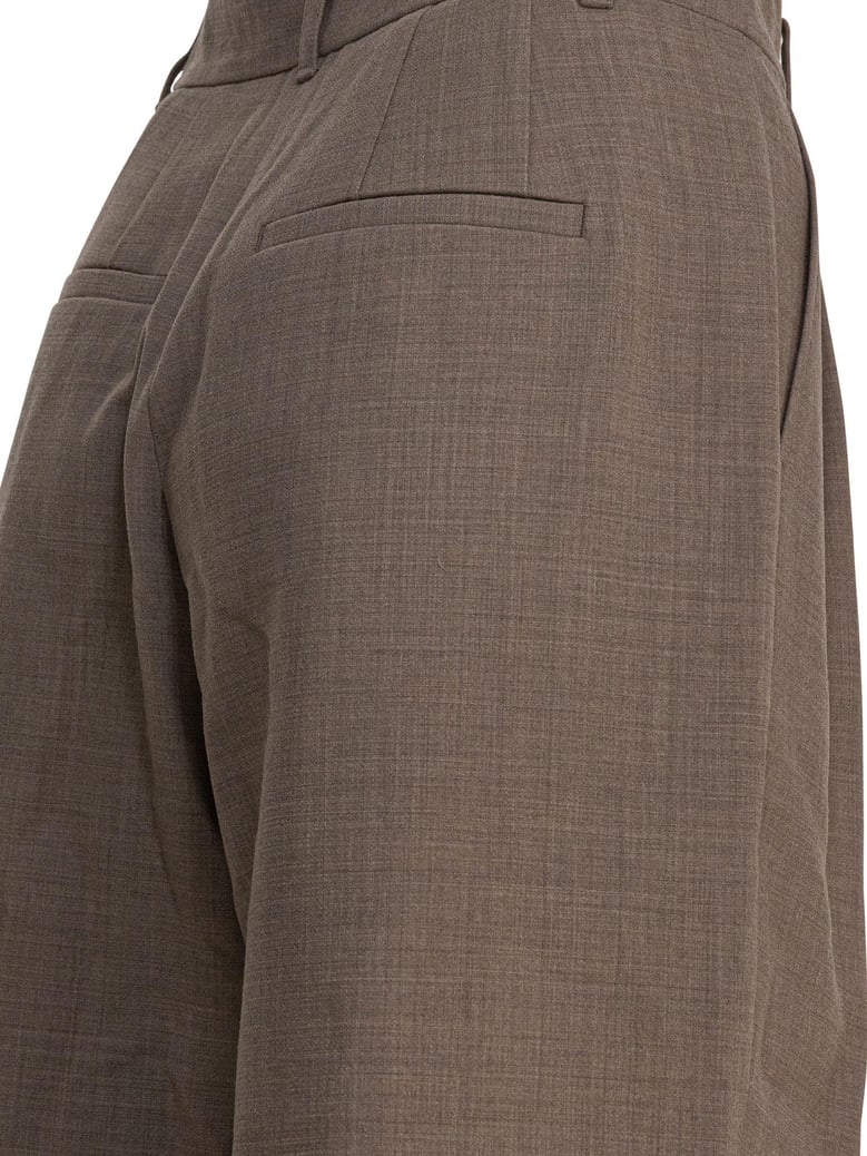 beige wool blend trousers by Selfnex