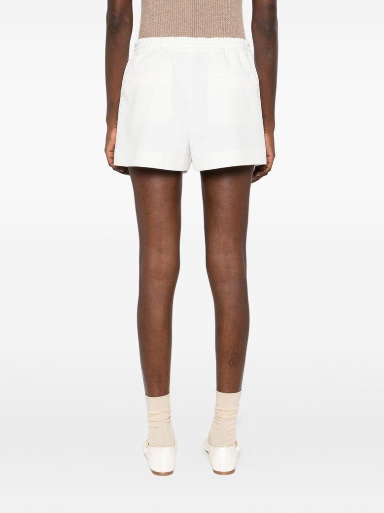white stretch piquet shorts by Selfnex