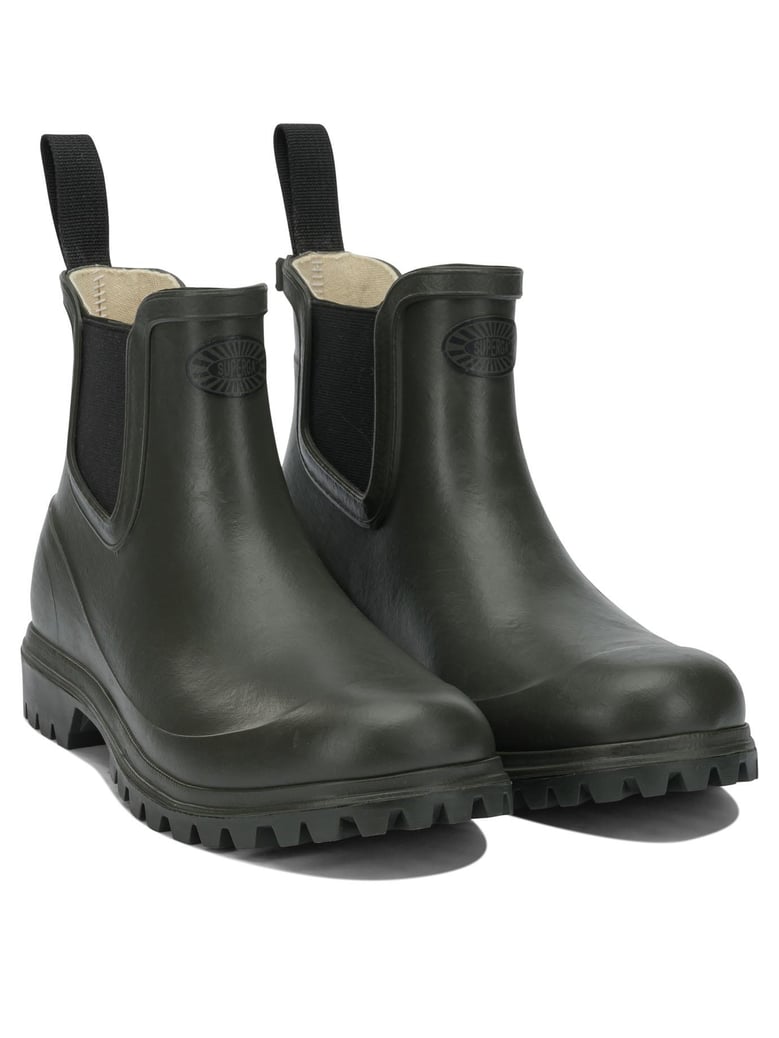 green rubber ankle boots by Selfnex