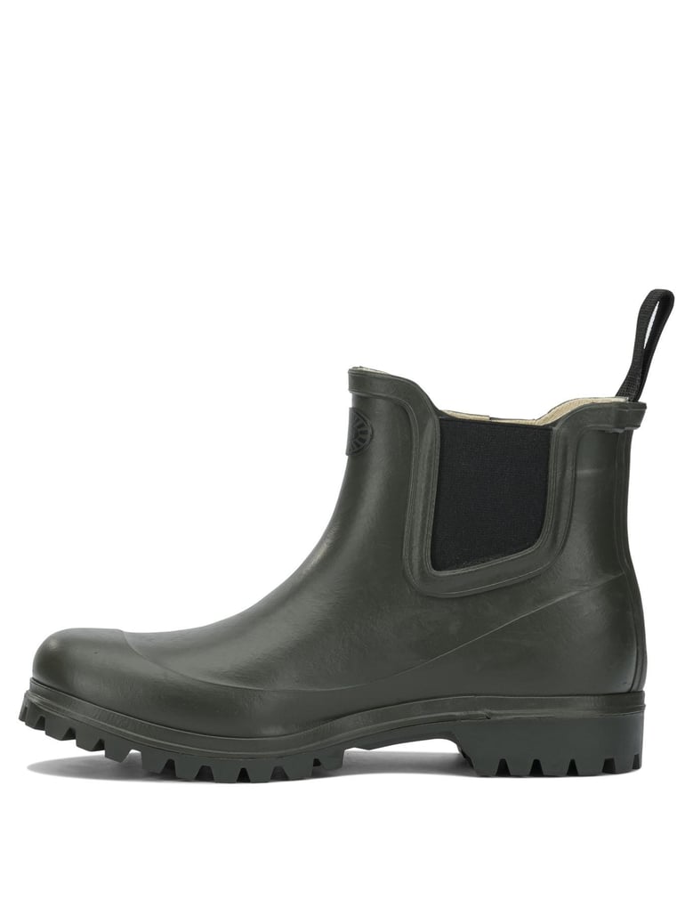 green rubber ankle boots by Selfnex