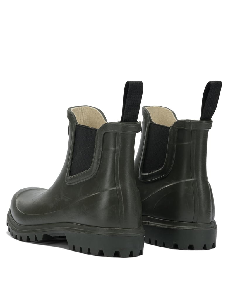 green rubber ankle boots by Selfnex