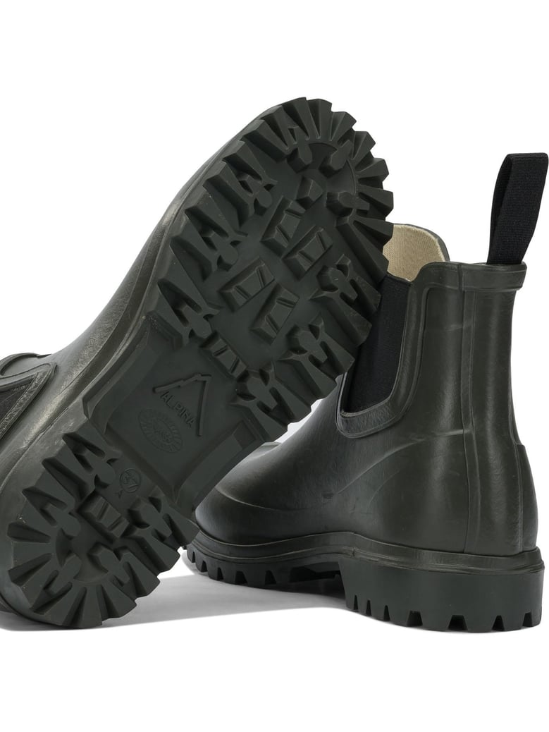 green rubber ankle boots by Selfnex