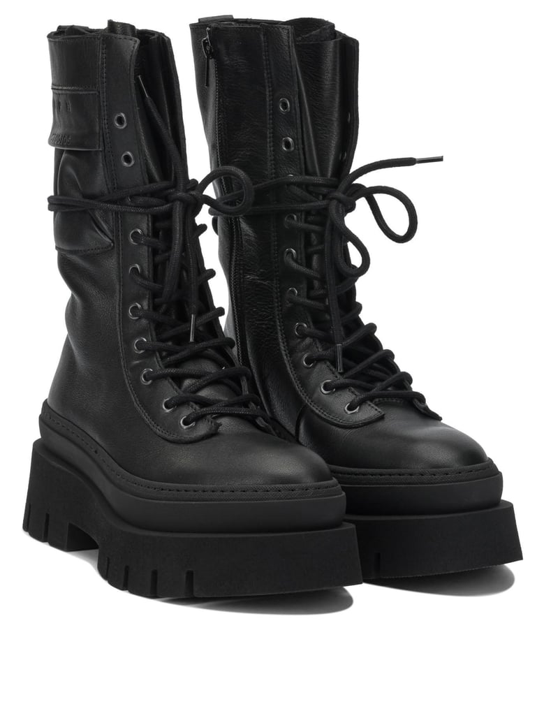 black leather ankle boots by Selfnex
