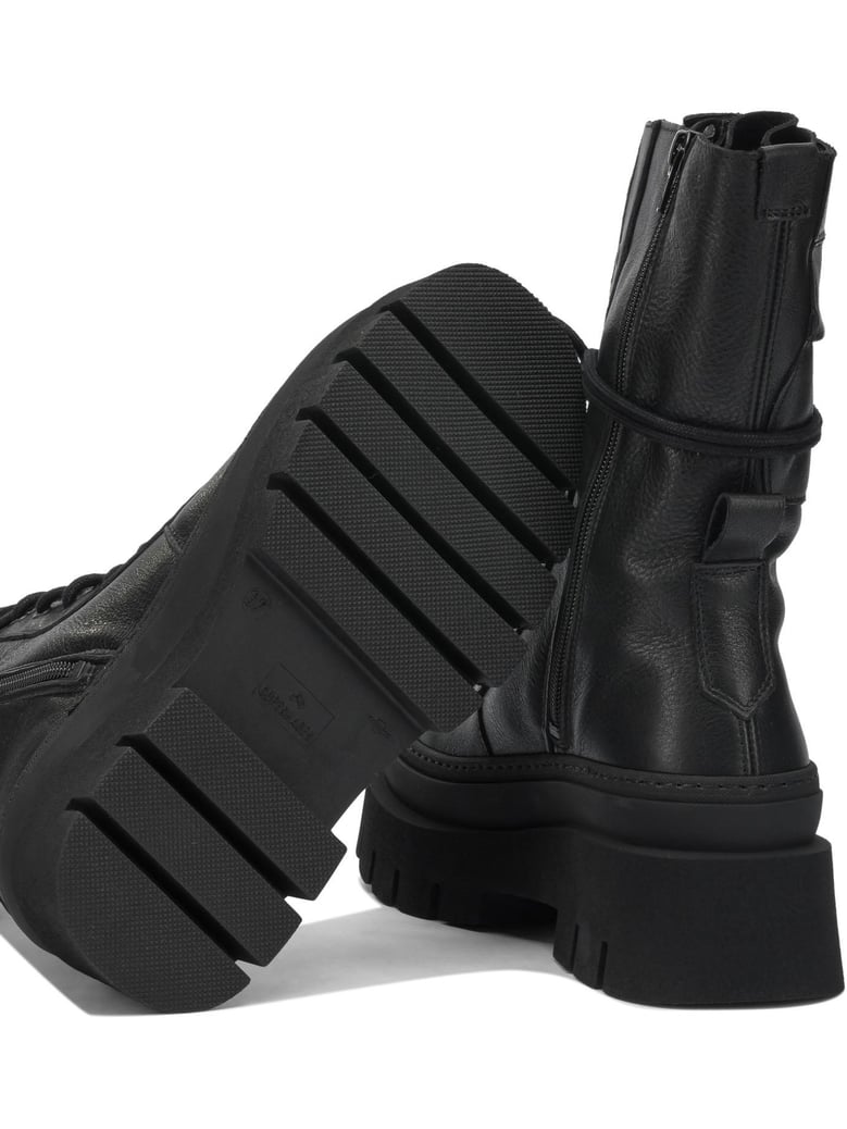 black leather ankle boots by Selfnex