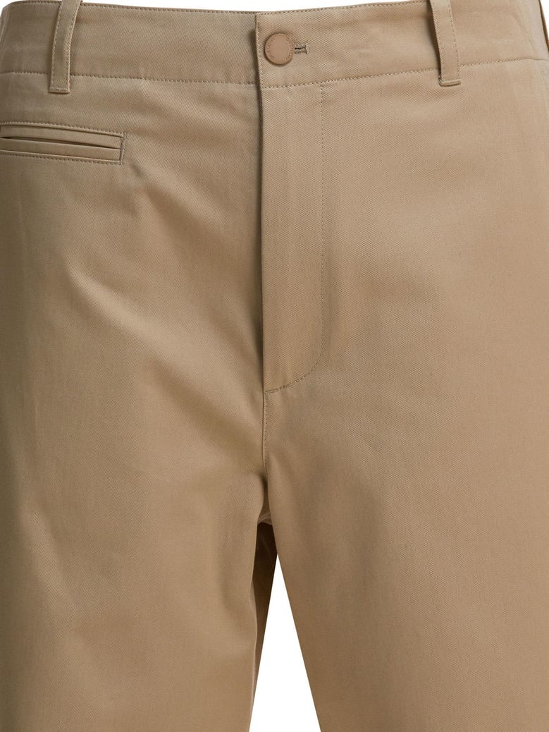 beige cotton trousers by Selfnex