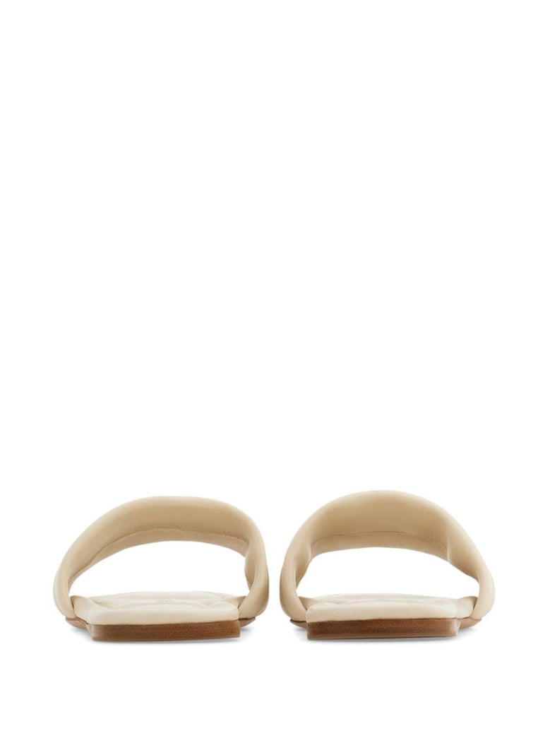 off-white lambskin slip-on sandals by Selfnex