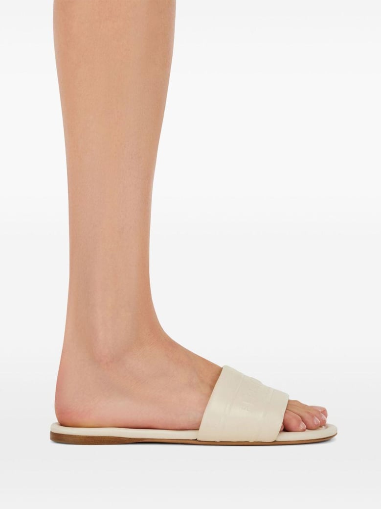 off-white lambskin slip-on sandals by Selfnex