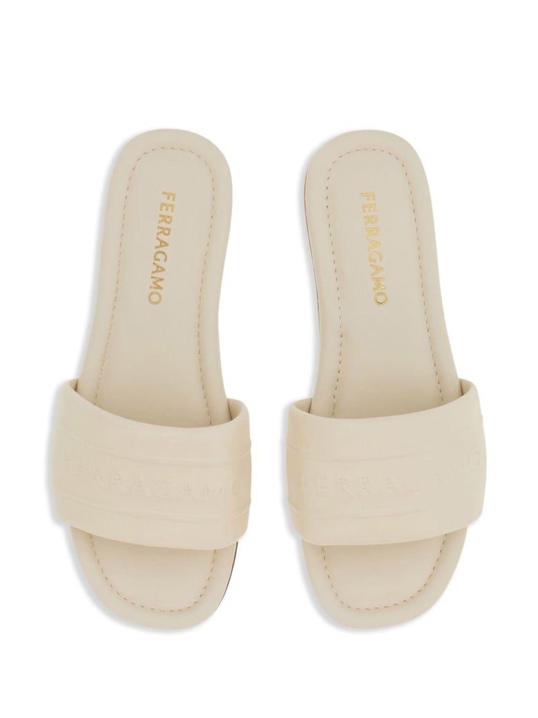 off-white lambskin slip-on sandals by Selfnex