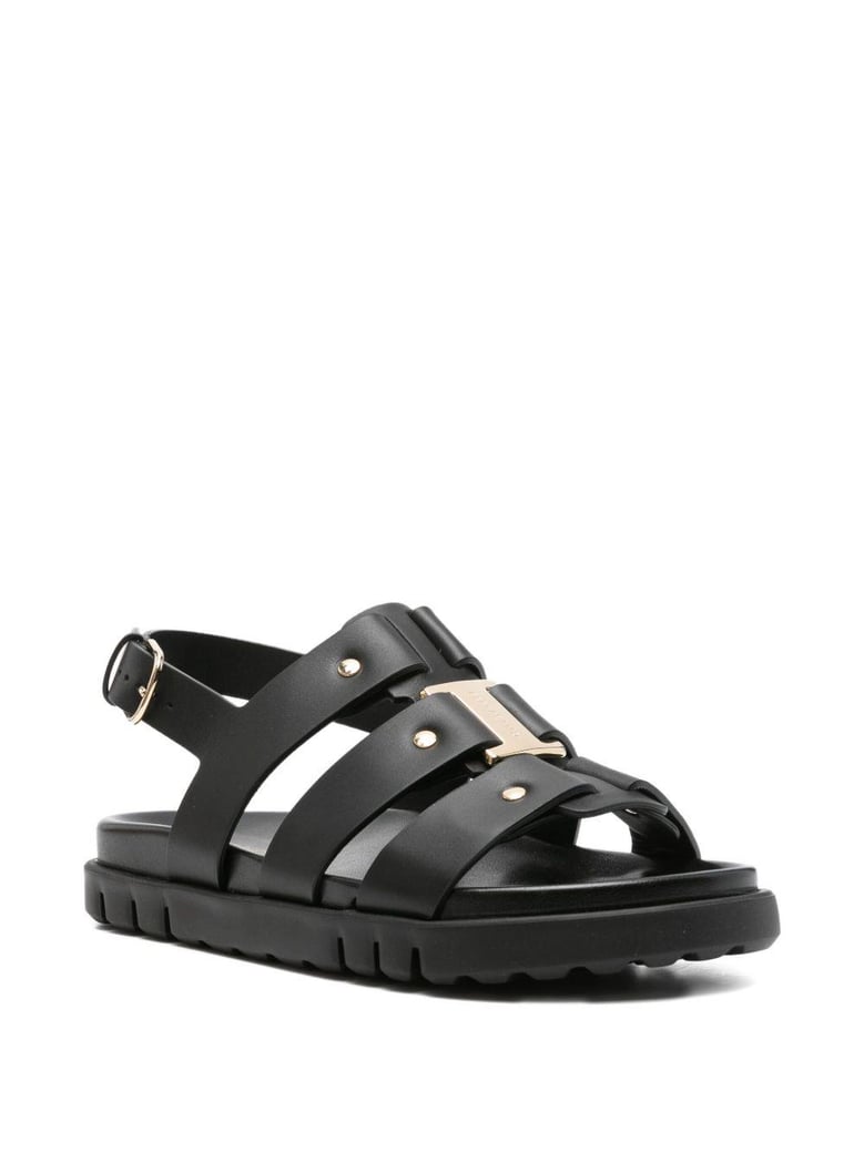 black buckle strappy heels by Selfnex