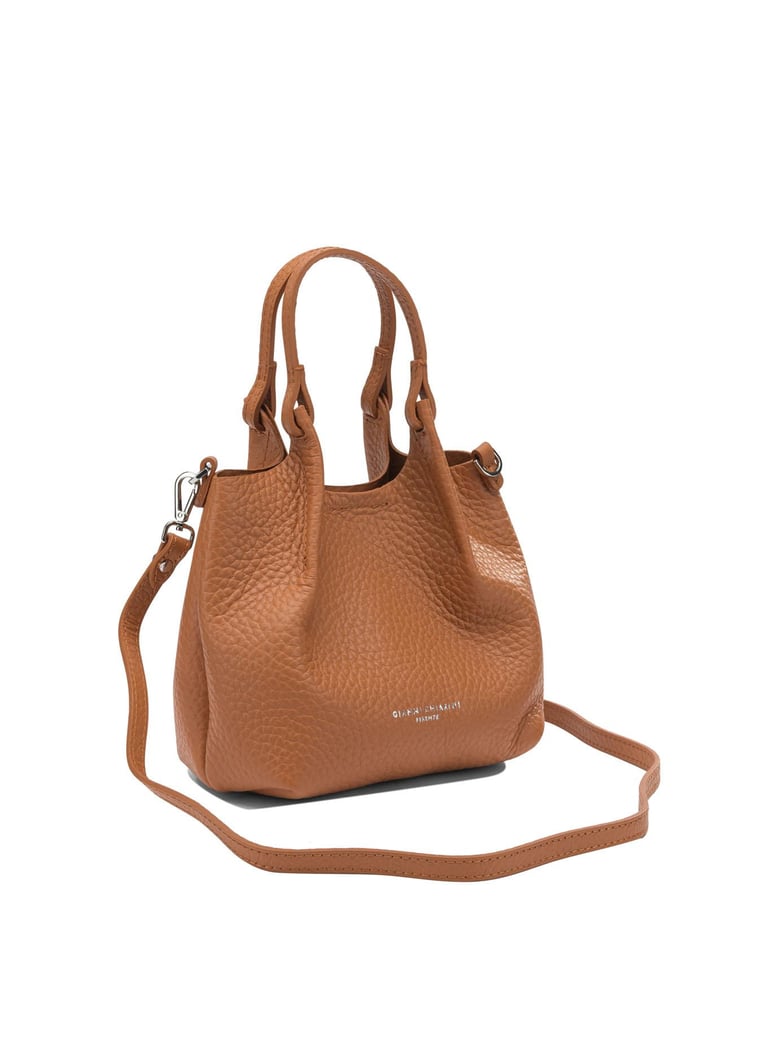 orange leather handbag by Selfnex