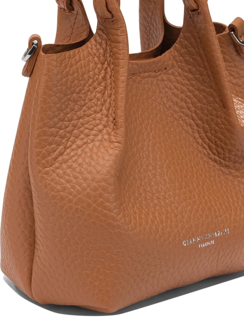 orange leather handbag by Selfnex