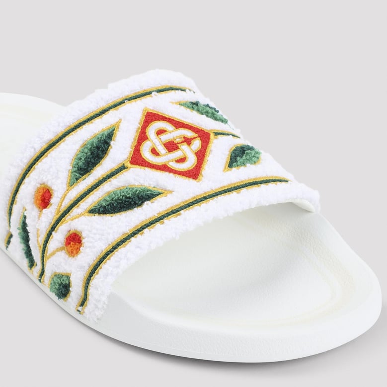 white embroidered terry sandals by Selfnex