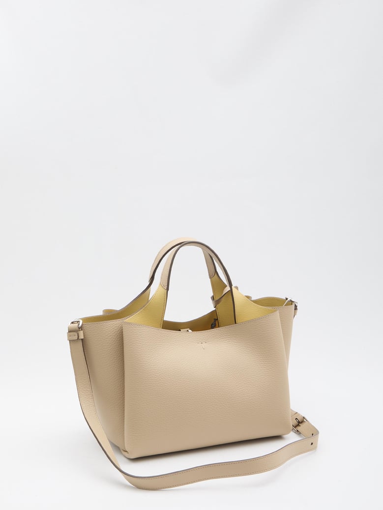 beige leather handbag by Selfnex