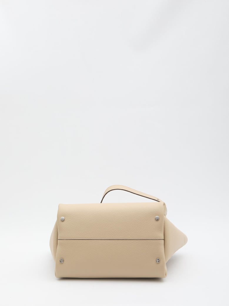 beige leather handbag by Selfnex