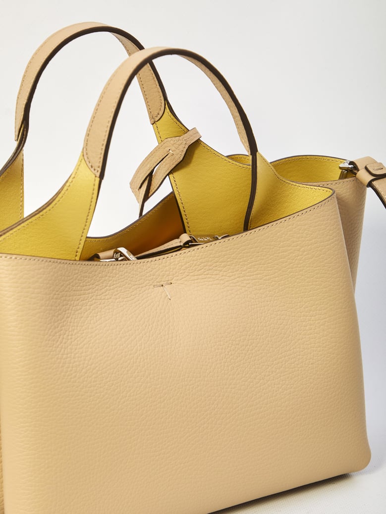 beige leather handbag by Selfnex