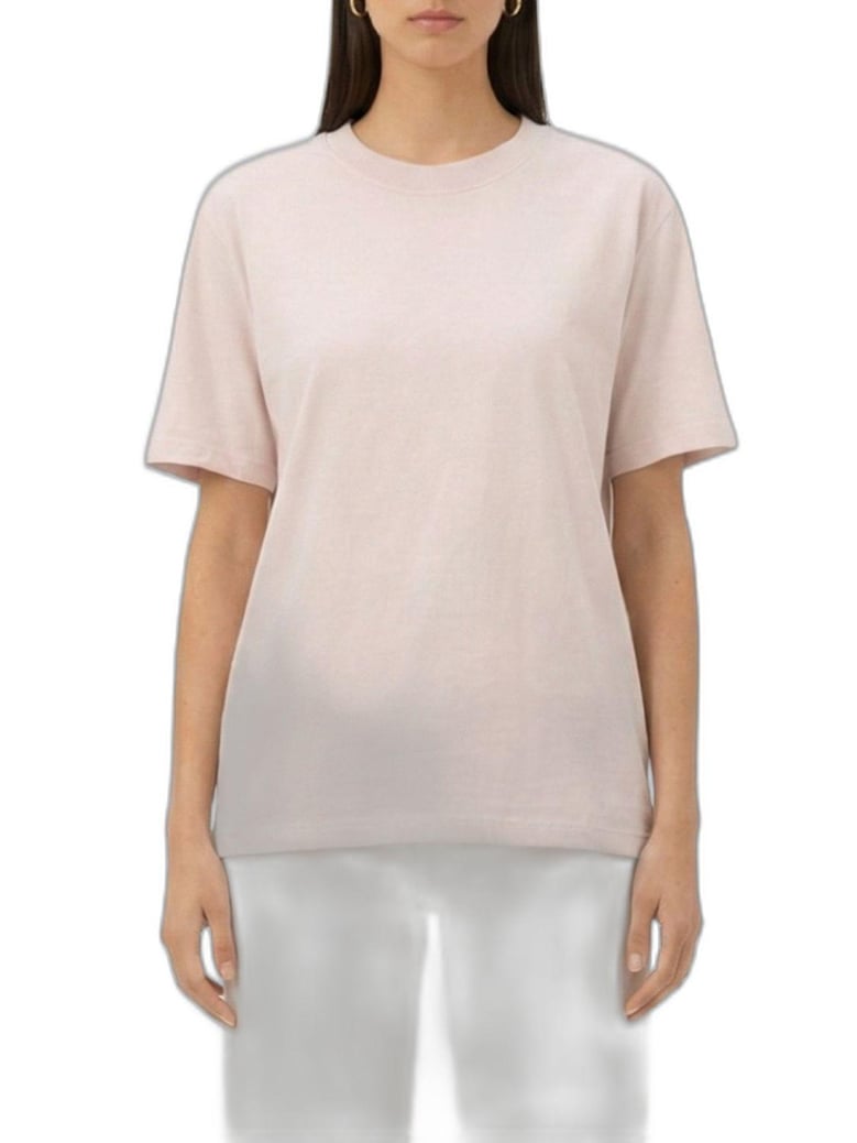 pink tshirt with reversed logo lettering on the back by Selfnex