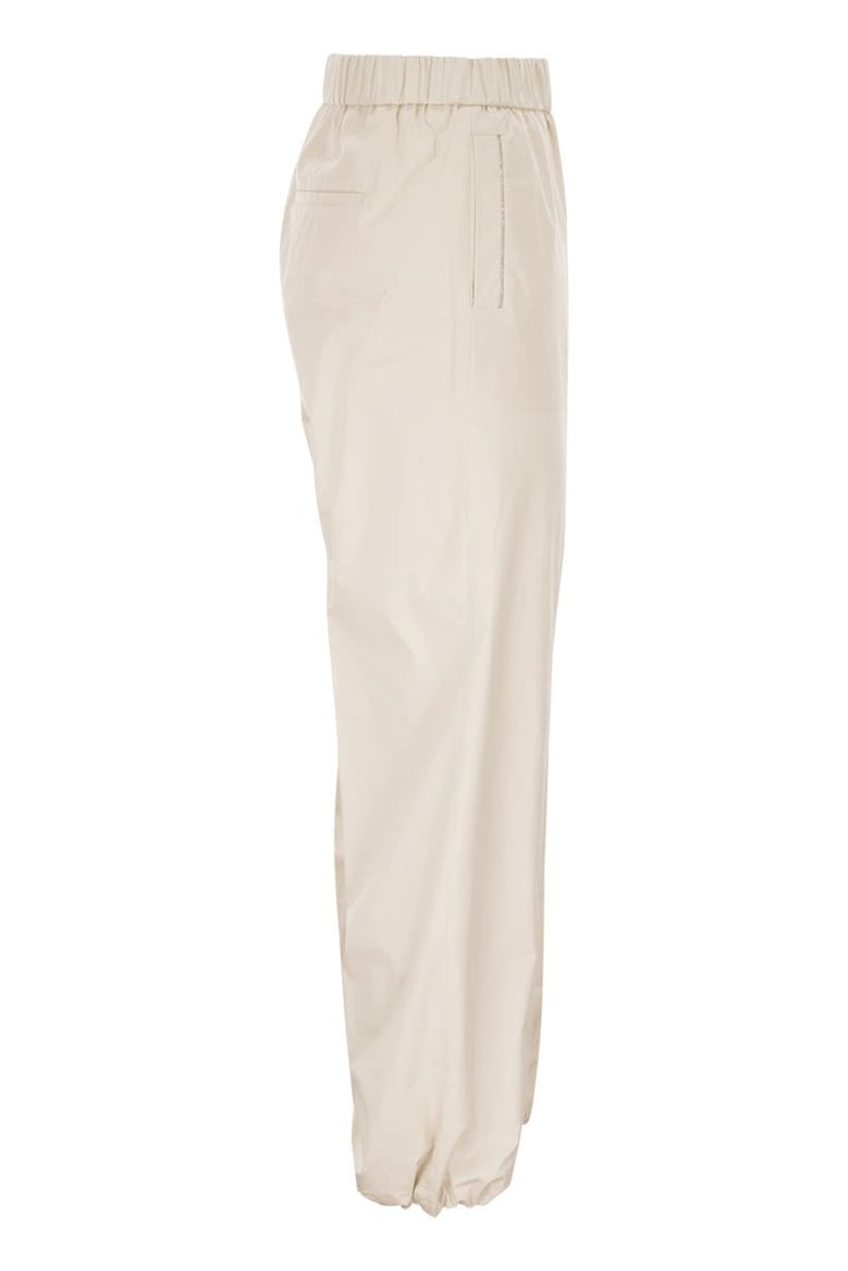 loose-fitting stretch cotton trousers with elasticated waistband by Selfnex