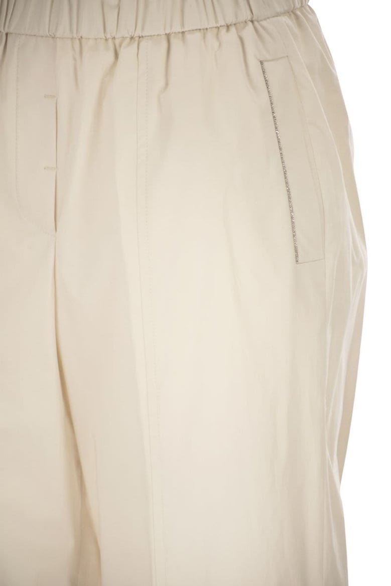 loose-fitting stretch cotton trousers with elasticated waistband by Selfnex