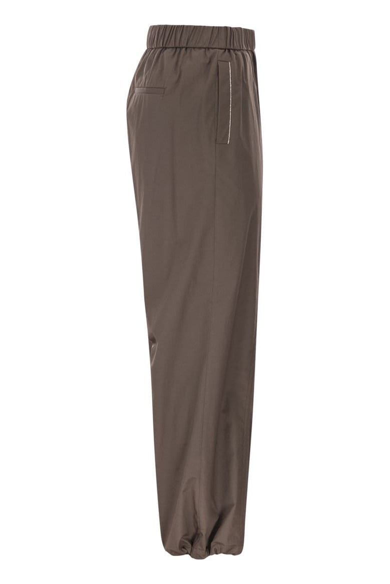 loose-fitting stretch cotton trousers with elasticated waistband by Selfnex