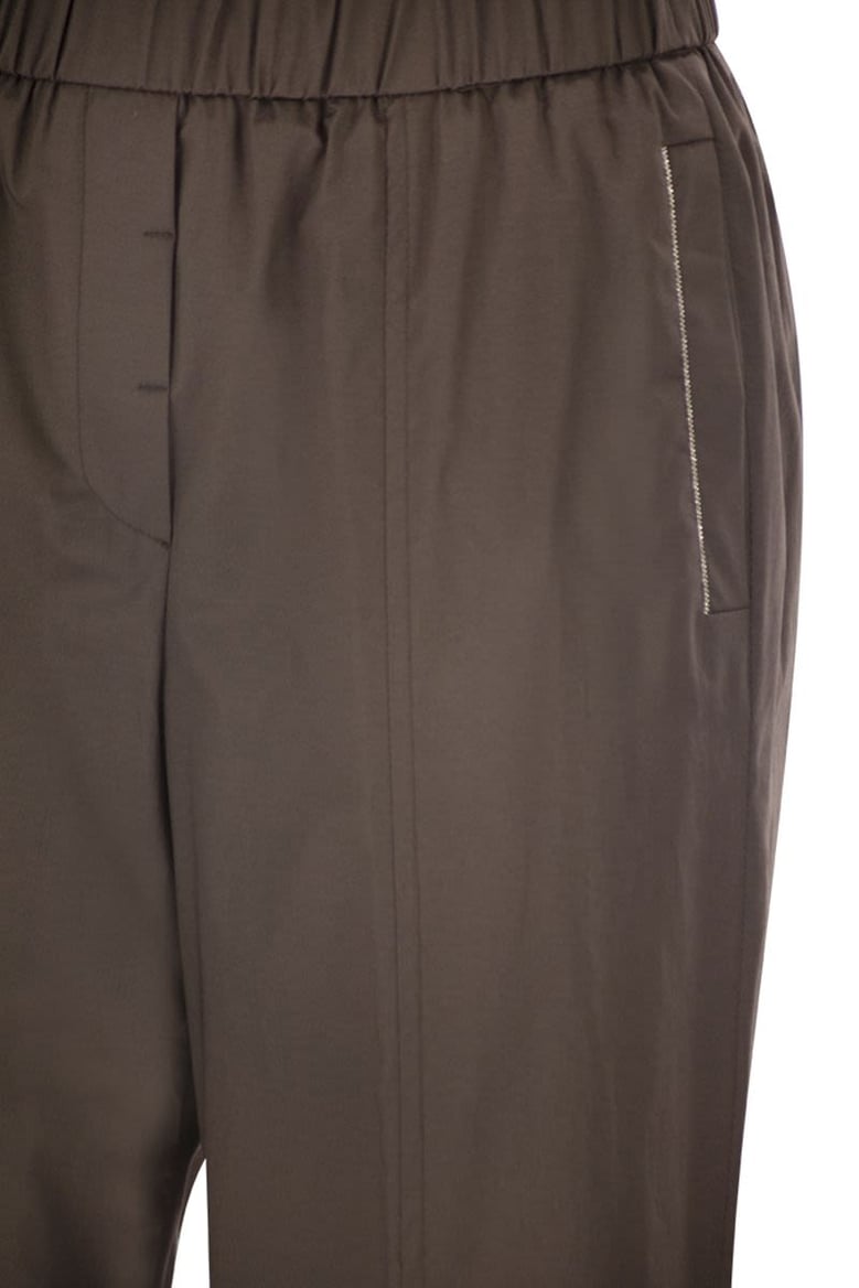 loose-fitting stretch cotton trousers with elasticated waistband by Selfnex