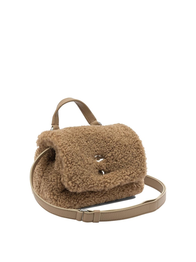 brown fabric handbag by Selfnex