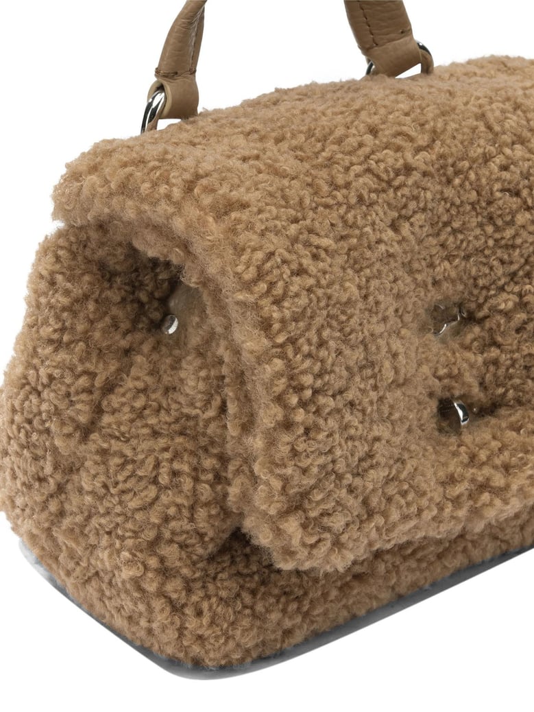 brown fabric handbag by Selfnex