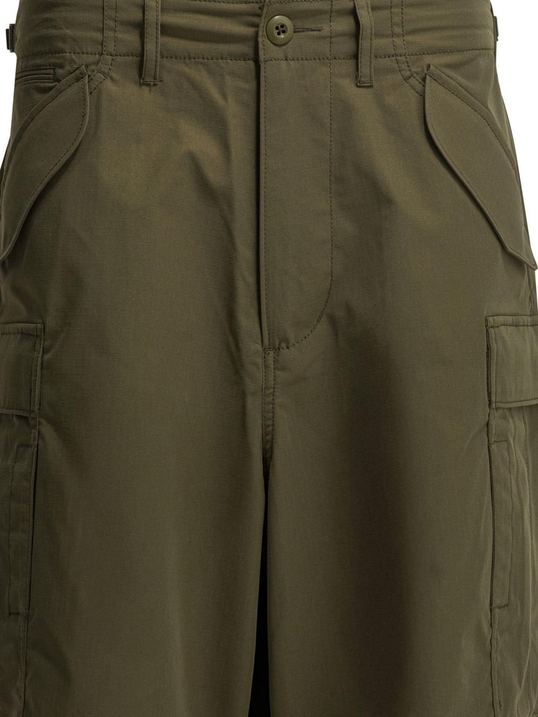 green polyester trousers by Selfnex