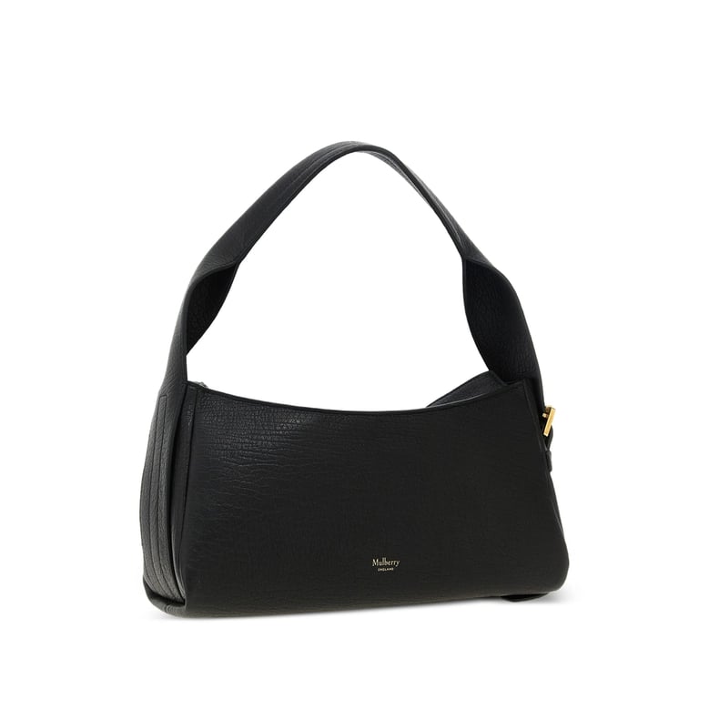 black shoulder bag with gold-tone hardware by Selfnex