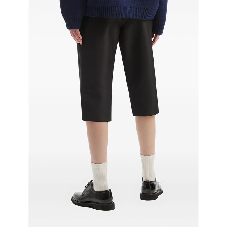 black side-slit trousers by Selfnex
