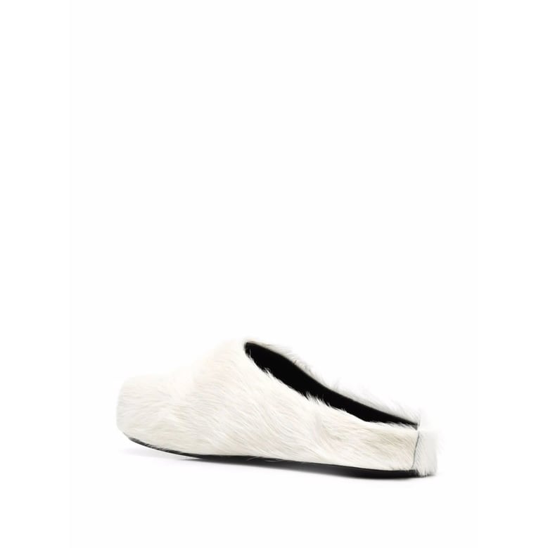white calf hair slip-on shoes by Selfnex
