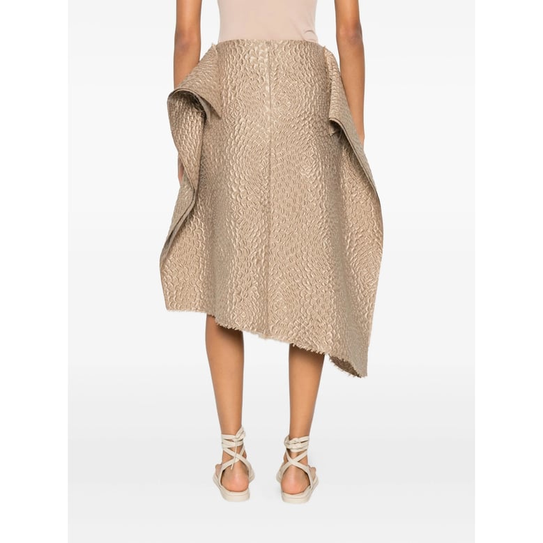 beige textured finish skirt with asymmetric hem by Selfnex