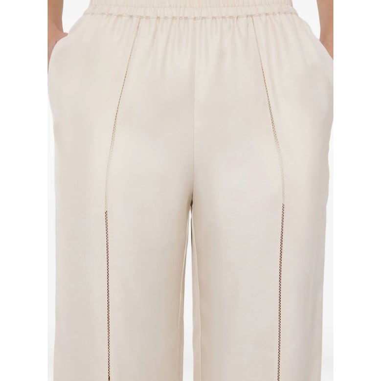 silk pant with lace-stitch detail by Selfnex