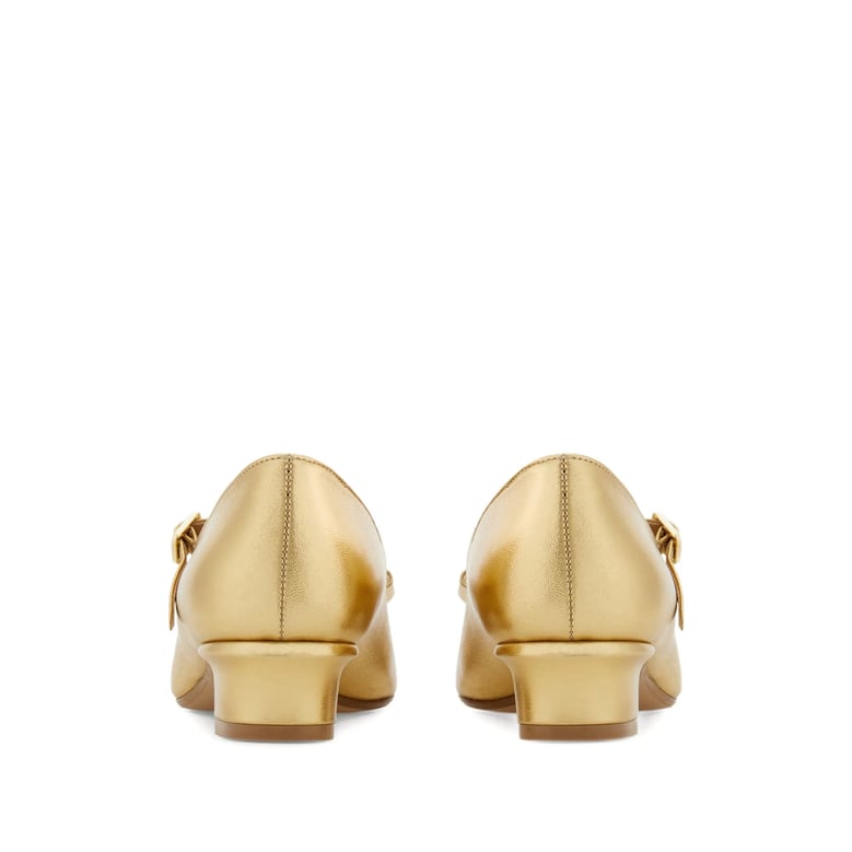 gold-tone laminated bow detail shoes by Selfnex