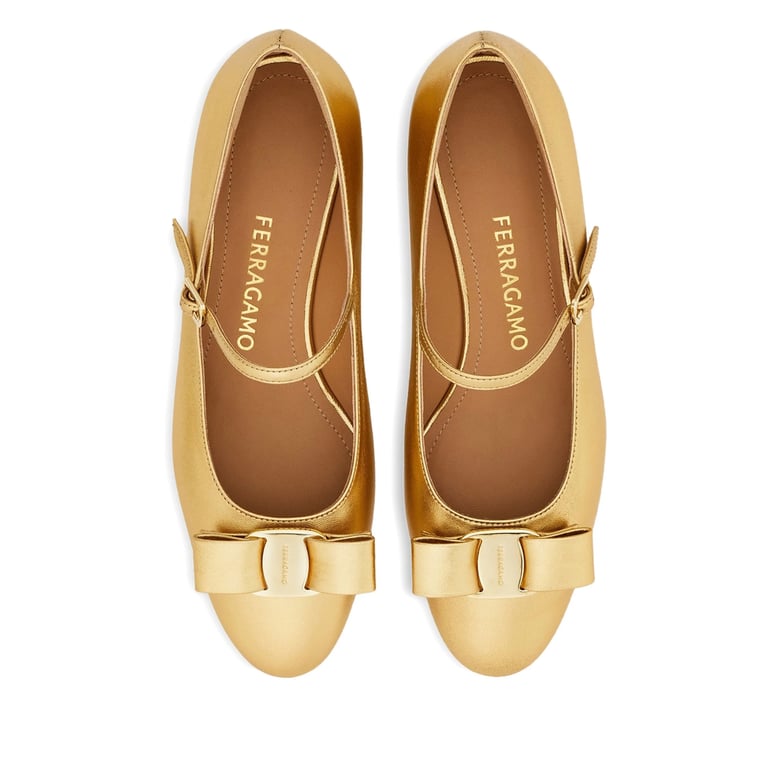 gold-tone laminated bow detail shoes by Selfnex