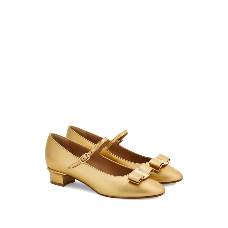 gold-tone laminated bow detail shoes by Selfnex