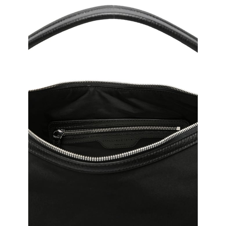 black top handle bag with zip pockets by Selfnex