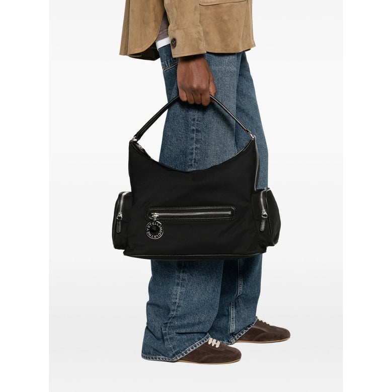 black top handle bag with zip pockets by Selfnex