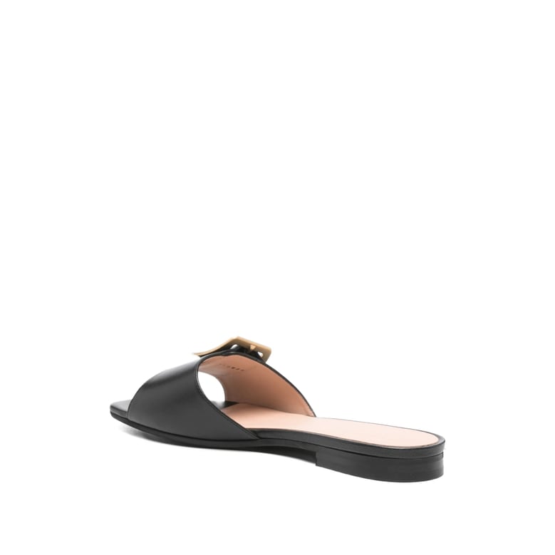 black open toe flats with gold-tone hardware by Selfnex