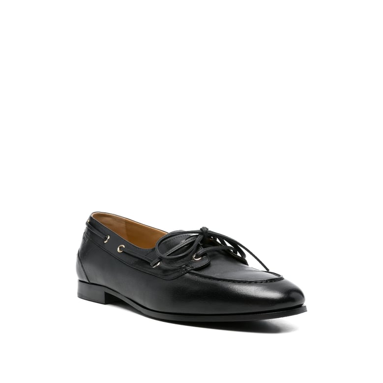 black leather loafers with gold hardware by Selfnex