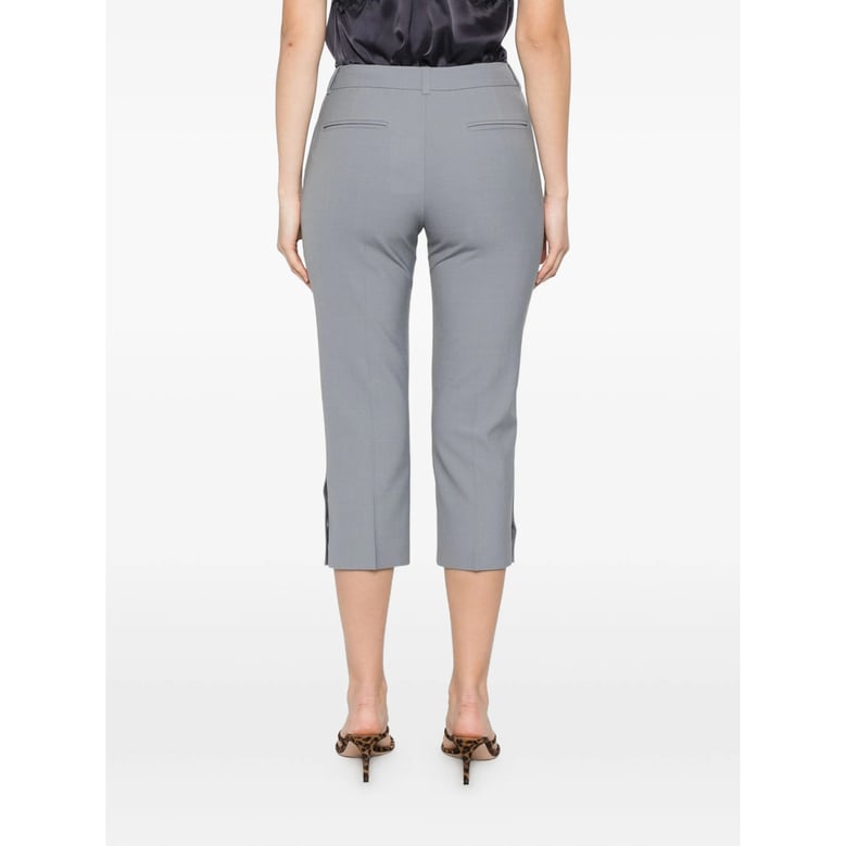 cropped trousers with button details by Selfnex