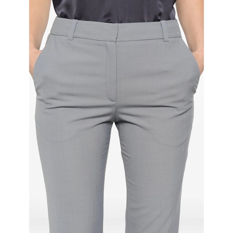 cropped trousers with button details by Selfnex