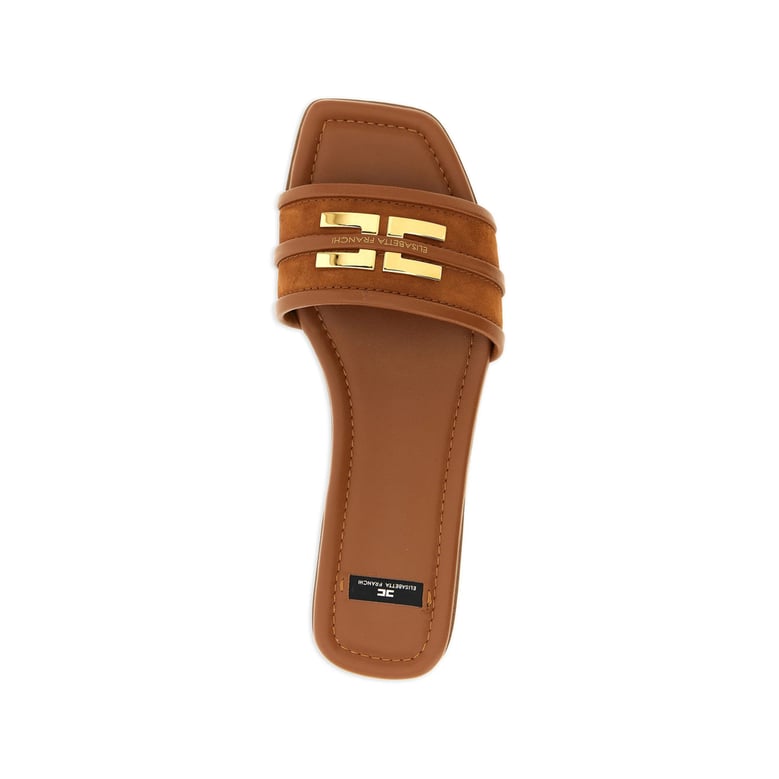 brown suede shoes with gold logo by Selfnex