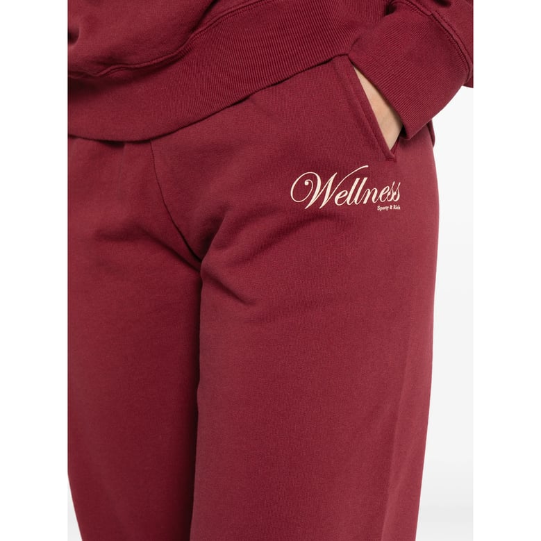 wine red track pants with logo detail by Selfnex