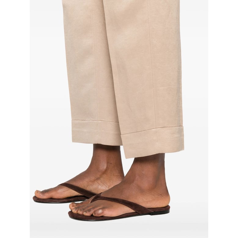 beige cuffed hem trousers by Selfnex