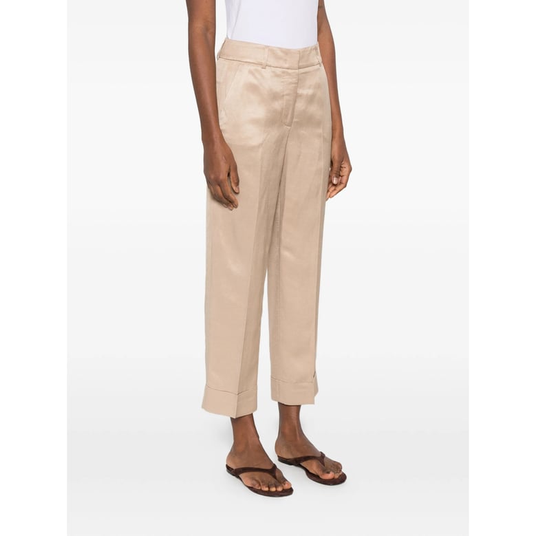 beige cuffed hem trousers by Selfnex