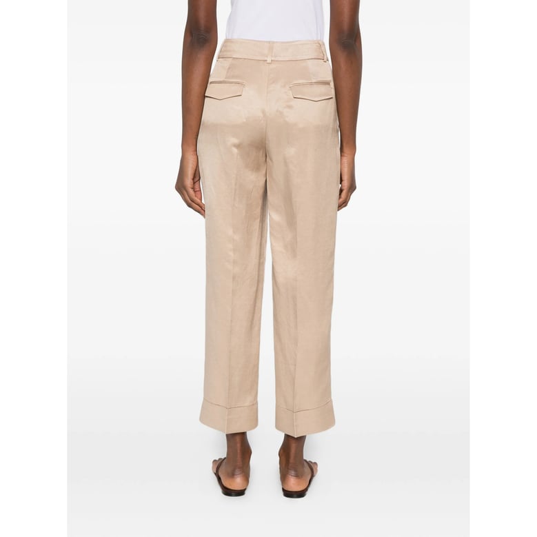 beige cuffed hem trousers by Selfnex