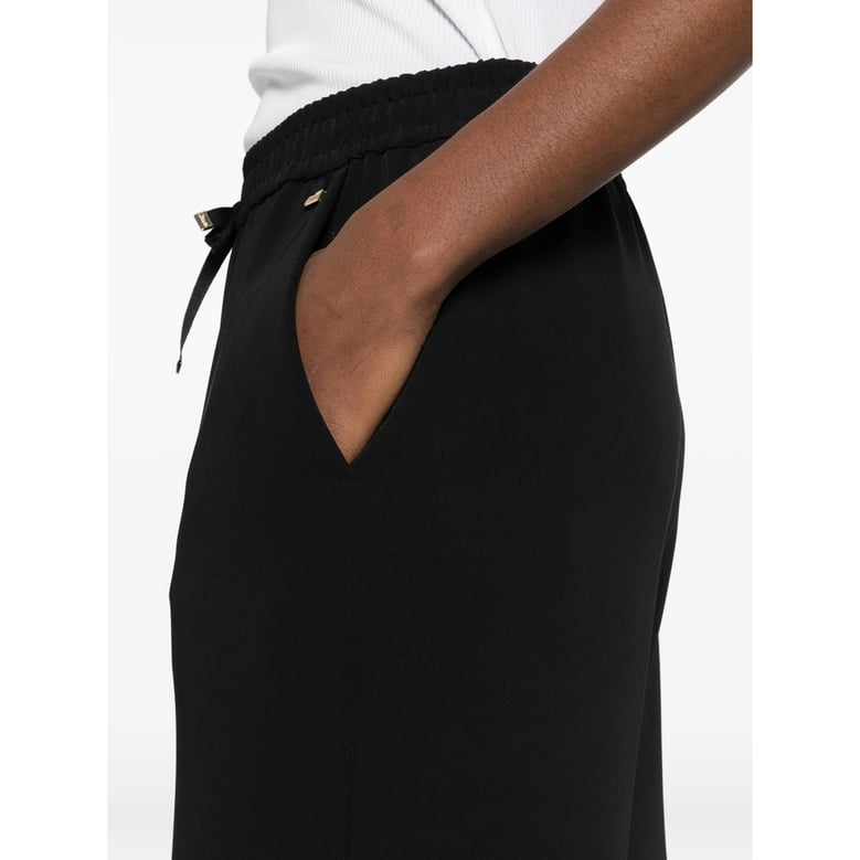 black drawstring trousers by Selfnex