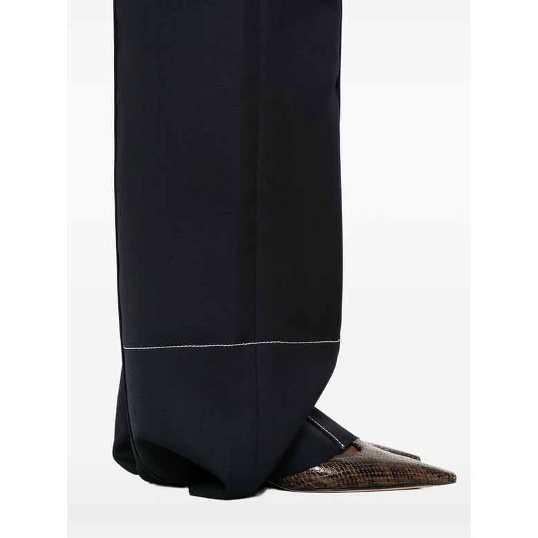 wide leg trousers with patch pockets by Selfnex